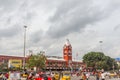 Busy scene in front of famous ancient railway station,vehicles pass by traffic signal,people are waiting to cross the road Royalty Free Stock Photo