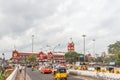 Busy scene in front of famous ancient railway station,vehicles pass by traffic signal,people are waiting to cross the road Royalty Free Stock Photo