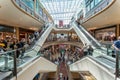 Busy scene with shoppers on escalators inside the Bullring Shopping Mall in Birmingham, West Midlands, UK