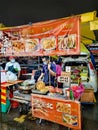 Street hawker busy scene in Taman Connaught night market in Kuala Lumpur Malaysia