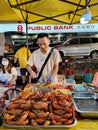 Busy scene in Taman Connaught night market in Kuala Lumpur Malaysia