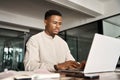 Busy professional African business man employee using laptop working in office. Royalty Free Stock Photo