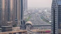 Busy Sheikh Zayed Road aerial day to night timelapse, metro railway and modern skyscrapers around in luxury Dubai city. Royalty Free Stock Photo