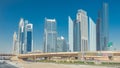 Busy Sheikh Zayed Road , metro railway and modern skyscrapers around in luxury Dubai city