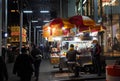 Busy shoppers fill the sidewalk on Fifth Avenue