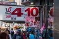 Busy sidewalk in Times Square, Manhattan New York City. Many tourist souvenir shops and a comedy club sign is seen Royalty Free Stock Photo