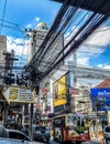 Busy street in Bangkok with electricity wires