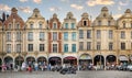 Busy street cafes in the Place des Heroes in Arras, France at sunset