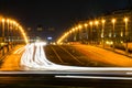 Busy street in the city at night, full of car light streaks dynamic night shot with long exposure Royalty Free Stock Photo