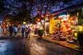 Busy street with colorful paper lantern lamps at night in the ancient town of Hoian. Hoi An, Vietnam - 28/01/2020