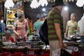 Busy street market. Vietnamese women cooking traditional dishes. Tourist buying street food. Scene before Covid-19 coronavirus