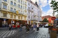 A busy street in Old Town Prague with tourists and locals window shopping and enjoying the medieval center of the city Royalty Free Stock Photo