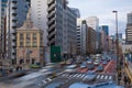 Busy street traffic in Tokyo, Japan with pedestrians crossing street Royalty Free Stock Photo