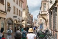 The busy streets in the historic old town of Strasbourg filled with tourists in high summer