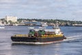 A busy summer for tugs in New Bedford harbor; tug Sirius transporting fuel trucks