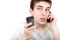 Busy teenager with two phones Royalty Free Stock Photo