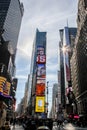 Busy Time Square with sun light, tourist and citizen in nice day seen from street Royalty Free Stock Photo