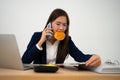 Busy and tired businesswoman eating Bread and milk for lunch at the Desk office and working to deliver financial statements to a Royalty Free Stock Photo