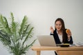 Busy and tired businesswoman eating Bread and milk for lunch at the Desk office and working to deliver financial statements to a Royalty Free Stock Photo