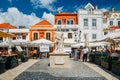 Busy touristic restaurants and bars area in the center of Cascais with traditional Portuguese architecture