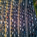 Busy traffic on a large highway, view from above. A lot of cars on the highway,