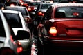 busy traffic on a wet city road on a rainy evening Royalty Free Stock Photo