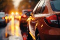 busy traffic on a wet city road on a rainy evening, city street in late autumn season