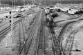 Busy trainyard with many trains on multiple switching tracks in