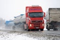 Busy Truck Traffic in Snowfall