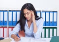 Busy turkish businesswoman at office Royalty Free Stock Photo