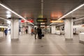 Busy underground metro station interior with diverse group of people Royalty Free Stock Photo