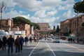 Busy urban street with zebra crossing and ancient Roman Colosseum, Rome, Italy Royalty Free Stock Photo