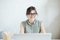 Busy woman designer having lunch in office. Royalty Free Stock Photo