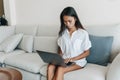 Busy asian woman working with computer at home Royalty Free Stock Photo