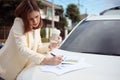 Busy woman is in a hurry, she does not have time, she is going to talk on the phone on the go. Businesswoman doing multiple tasks Royalty Free Stock Photo