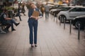 Busy woman is in a hurry, she does not have time, she is going to talk on the phone on the go. Businesswoman doing Royalty Free Stock Photo