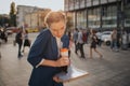 Busy woman is in a hurry, she does not have time, she is going to eat snack on the go. Worker eating, drinking coffee Royalty Free Stock Photo