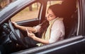 Busy woman is in a hurry, she does not have time, she is going to worck on the go. Worker talking on the phone at the Royalty Free Stock Photo