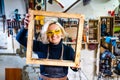 Busy wood designer in a small carpentry workshop