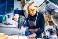 Busy wood designer in a small carpentry workshop