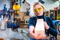 Busy wood designer in a small carpentry workshop