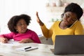 Busy Working African American Mother Ignoring Her Little Daughter Asking For Attention Royalty Free Stock Photo