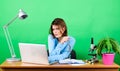 Busy working in office. chemist biologist with microscope on table. woman work in office on laptop. digital science