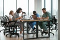 Busy by working by table. Group of doctors are together indoors Royalty Free Stock Photo