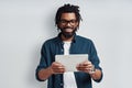 Busy young African man in eyewear