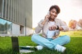 Busy young asian man digital nomad working at public park Royalty Free Stock Photo