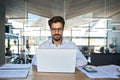 Busy young business man working on laptop using computer in office. Royalty Free Stock Photo