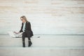 Busy young business woman talking on her mobile phone