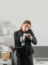 Busy young businesswoman, frustration secretary girl working overtime. Secretary accountant woman working alone late in Royalty Free Stock Photo