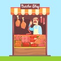 Butcher Behind Market Counter With Assortment Of Meat